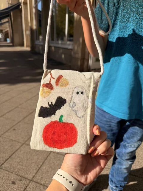 Pumpkin, bat and ghost on a Halloween bag