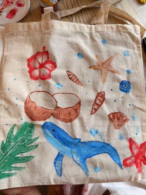 Hand-painted tote bag with a whale, coral, shells and starfish